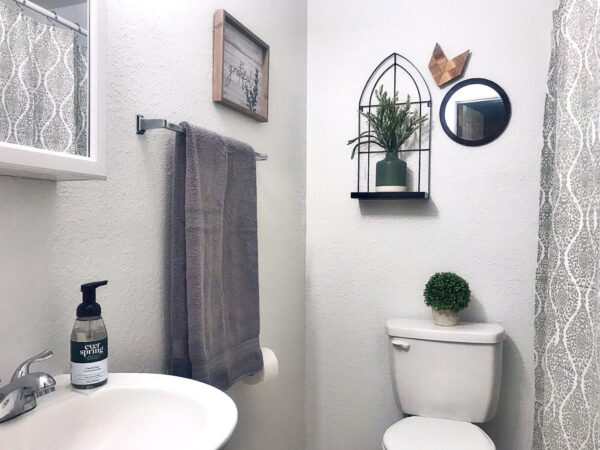 Alamo Studio Dwelling E bathroom with sink and toilet grey overtones
