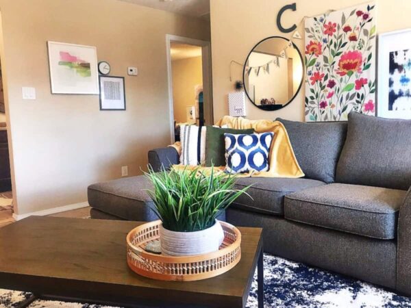Alamo Apartment C stylish living room with sofa and colorful prints
