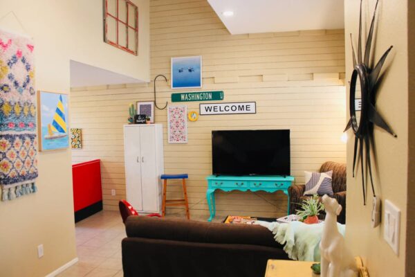 vintage dwelling quirky living room with tv and turquoise tv stand