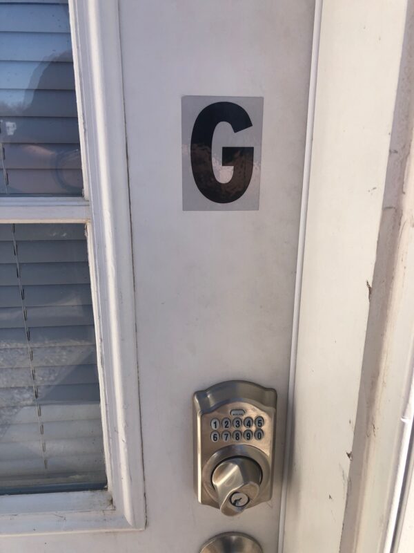 Alamo Studio Dwelling G door with letter designation and keypad